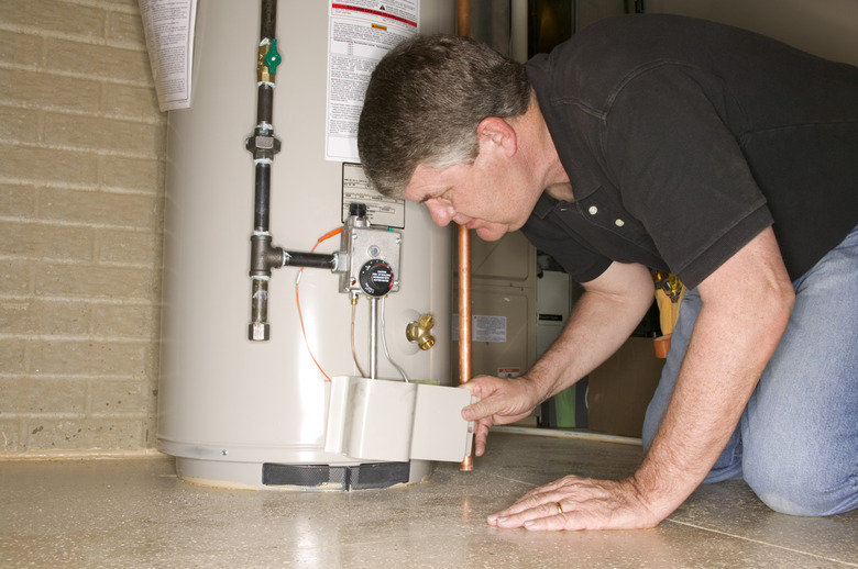 Man checking water heater