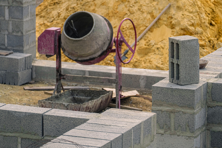 Concrete construction block on wall. Selective focus on block.