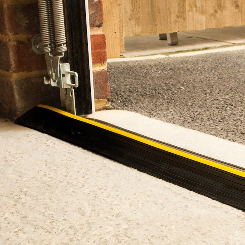 A black PVC garage door threshold