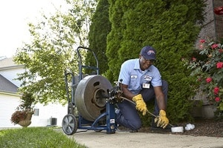 Clearing out a sewer.