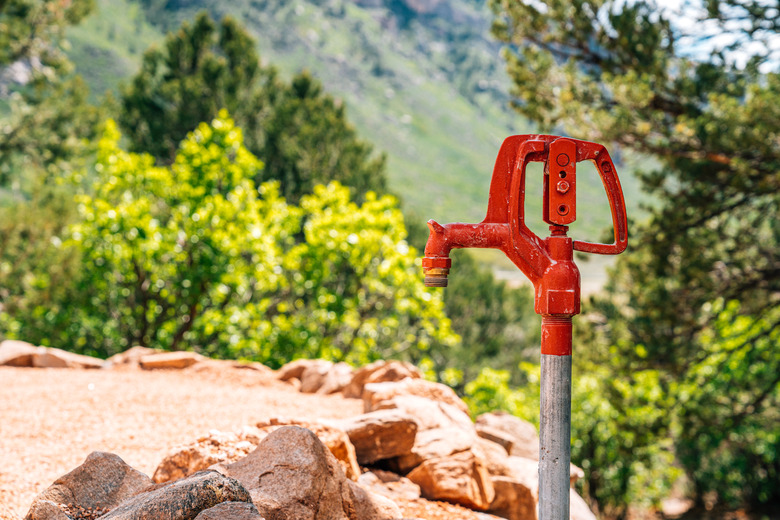 Close-Up Shot of a Variable Flow Yard Hydrant Outdoors in the Summer