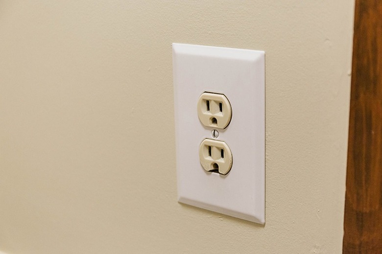 A double electrical outlet on a wall