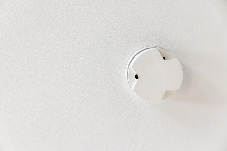 Smoke detector on a white ceiling