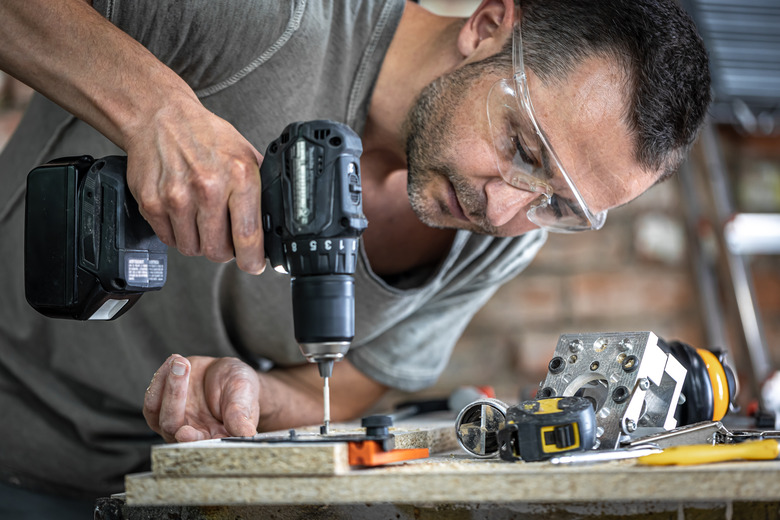 Carpenter using wood screws.