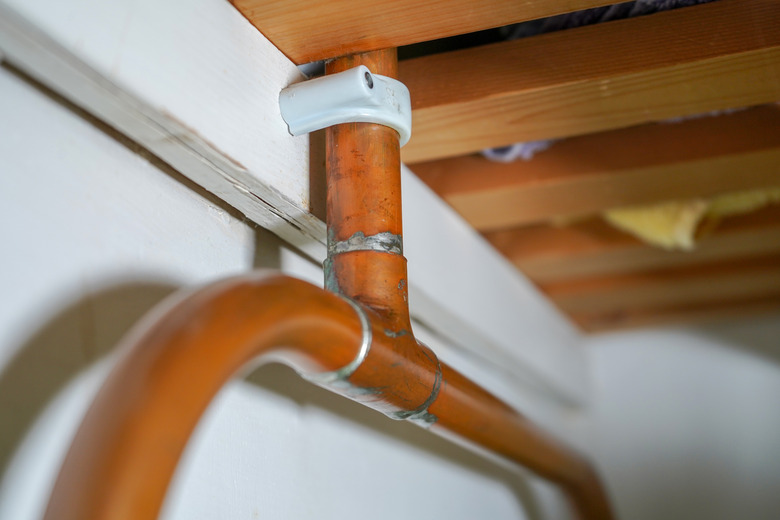 Closeup of domestic copper pipe plumbing.