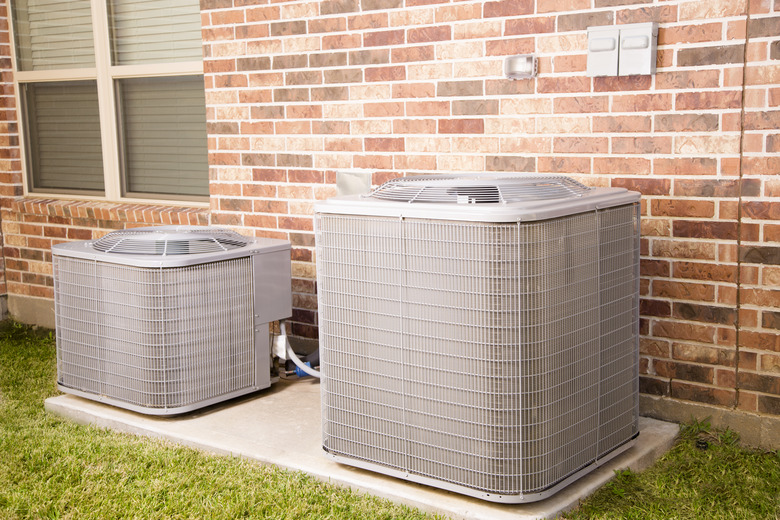 Service Industry: Two air conditioner units outside home.