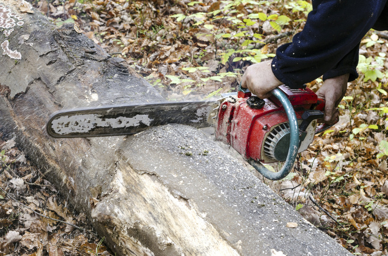 Hands with chainsaw