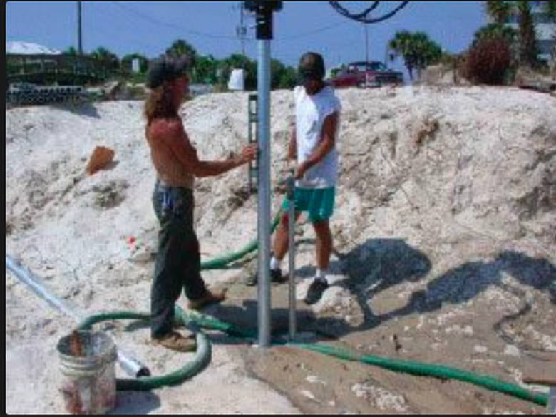 Driving a foundation pile into the ground.