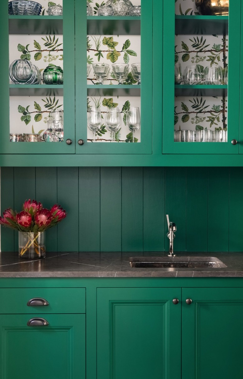 Green kitchen cabinets with matching shiplap backsplash