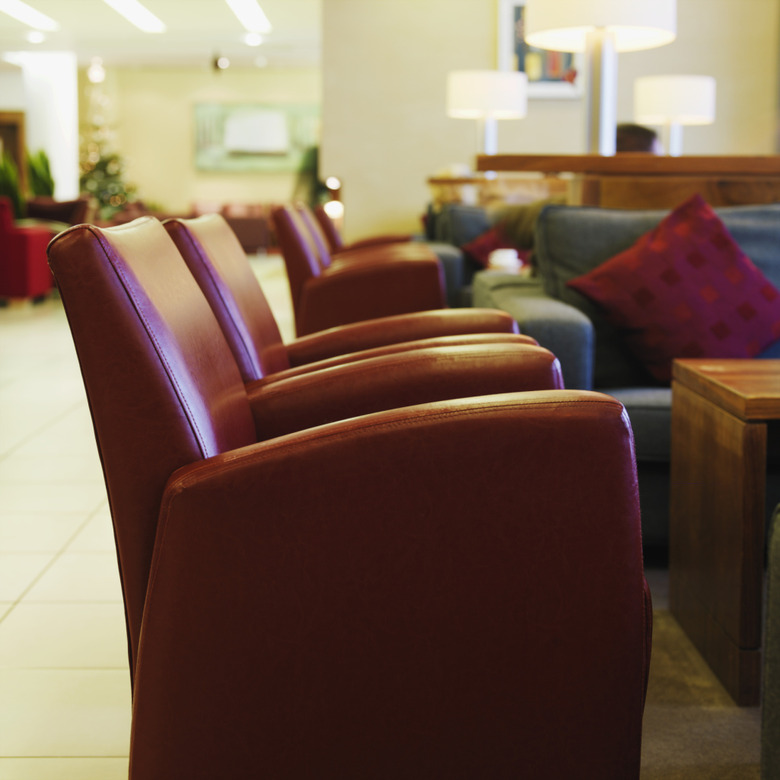 Side view of leather armchairs in hotel foyer