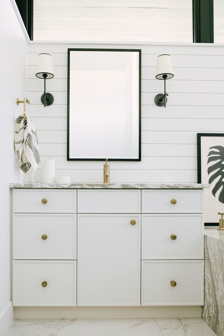 White Bathroom Cabinets by Jaclyn Peters Design