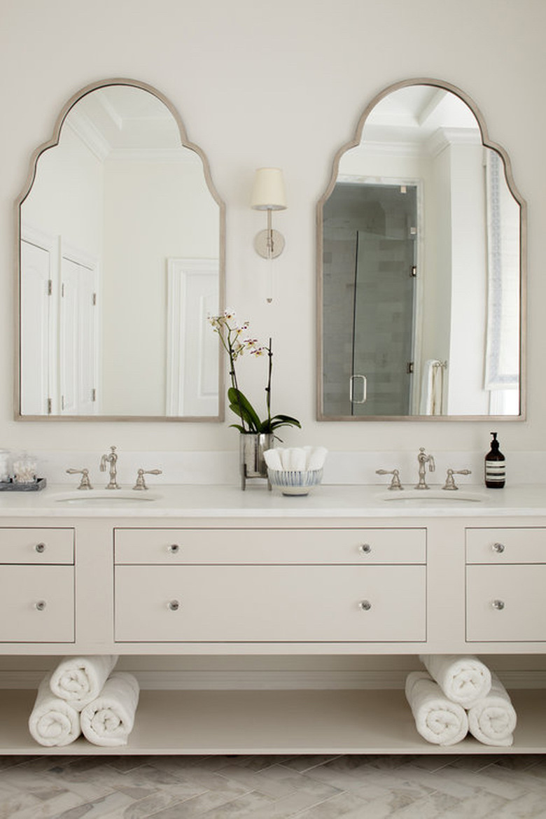 white bathroom countertop in classic design with beige vanity cabinet