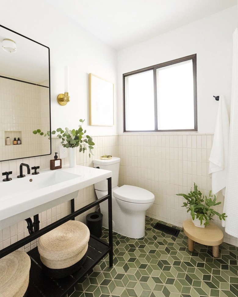 white bathroom countertop with green geometric floor tile