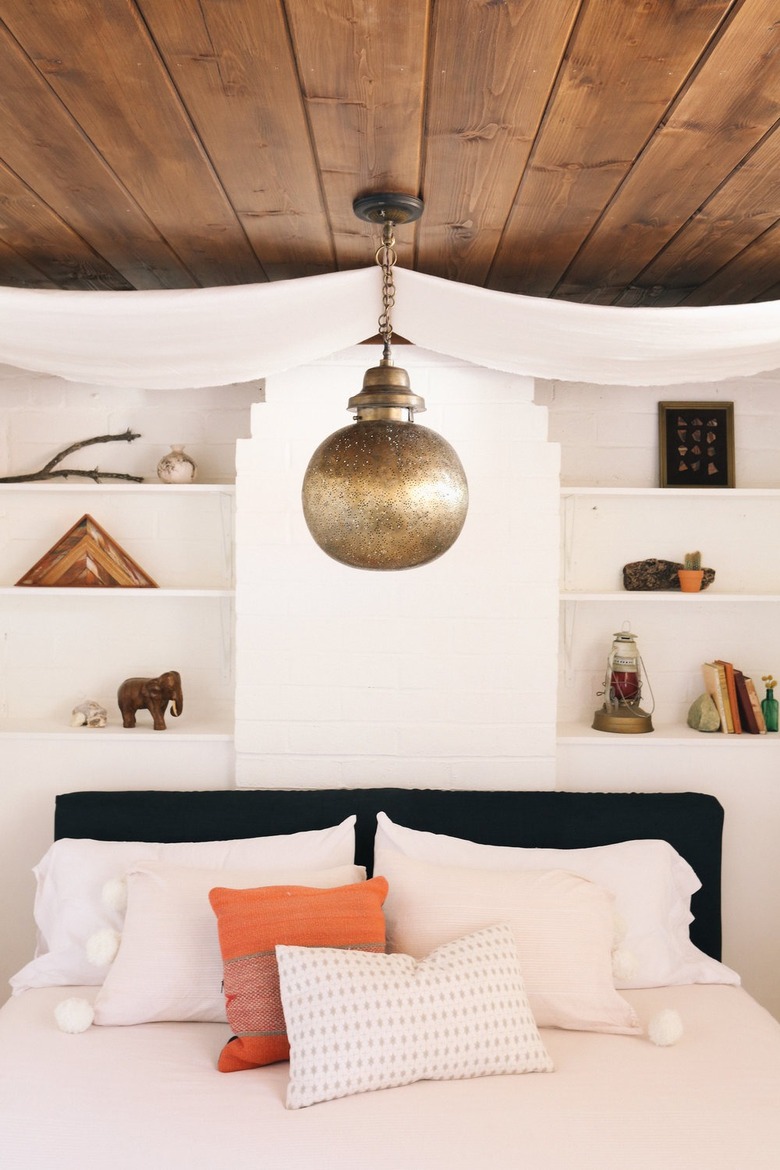 white bohemian bedroom with global decor