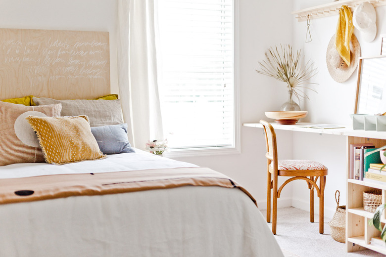 white bohemian bedroom with wooden details