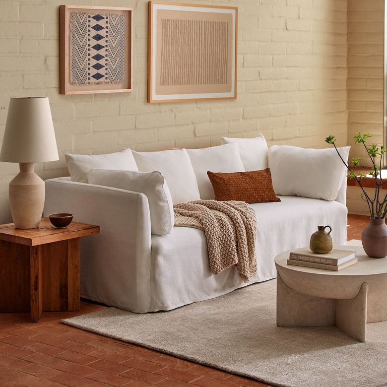 white slipcover couch in neutral-tone living room