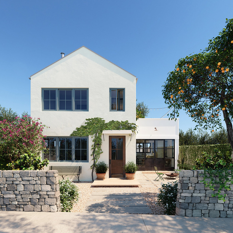 white home exterior with wood door and blue casement window trim