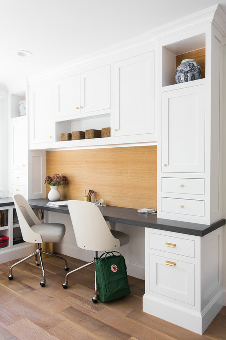 white home office idea with desk, chair, and cabinets