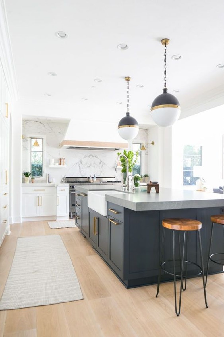 dark kitchen island with concrete countertop