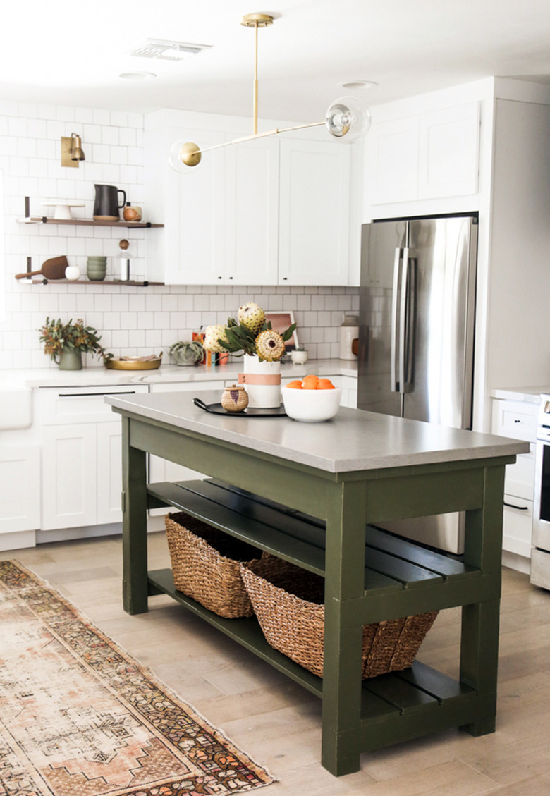 white kitchen with small olive green kitchen island