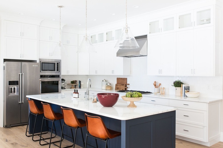 white kitchen cabinets with blue kitchen island