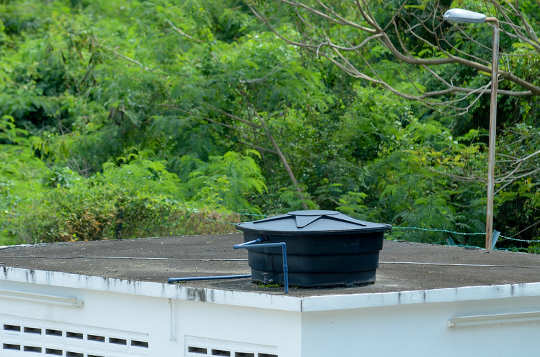 Black water storage tank on rooftop.