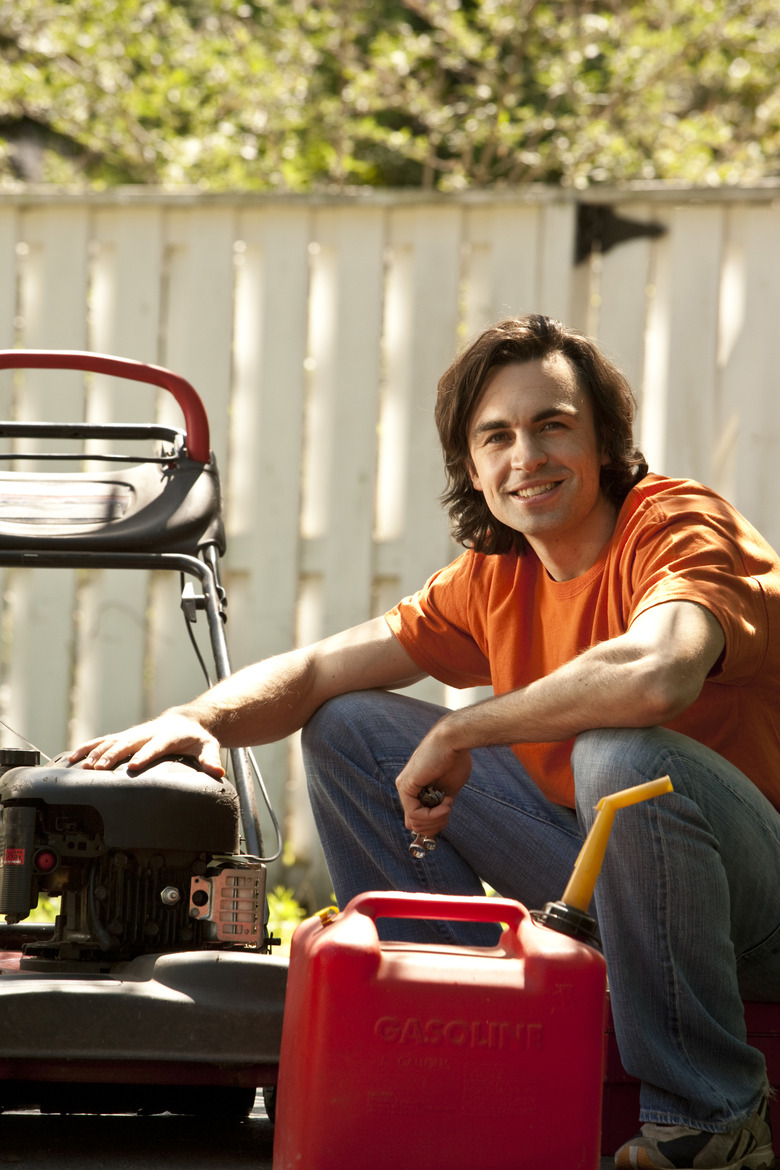 man with lawn mower