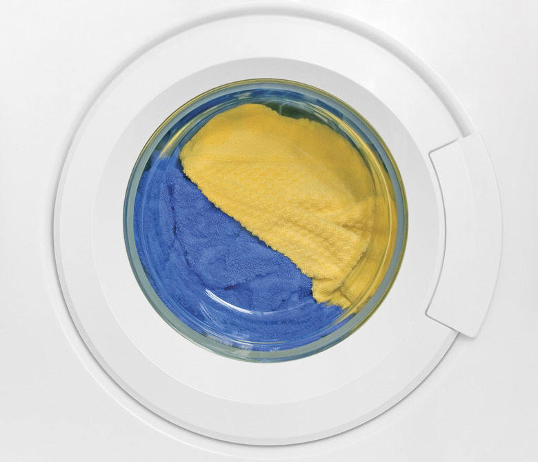 Washing machine door, clean colorful clothes, yellow, blue plush terry