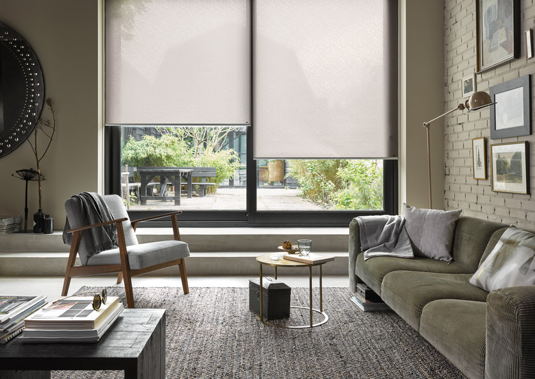 window treatments for sliding glass doors in large modern living room with glass sliding doors and roller blinds