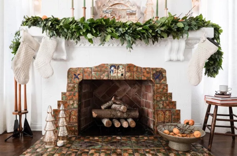 Mantle decorated with garland, white stockings.