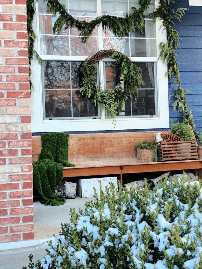 winter front porch with vintage pew