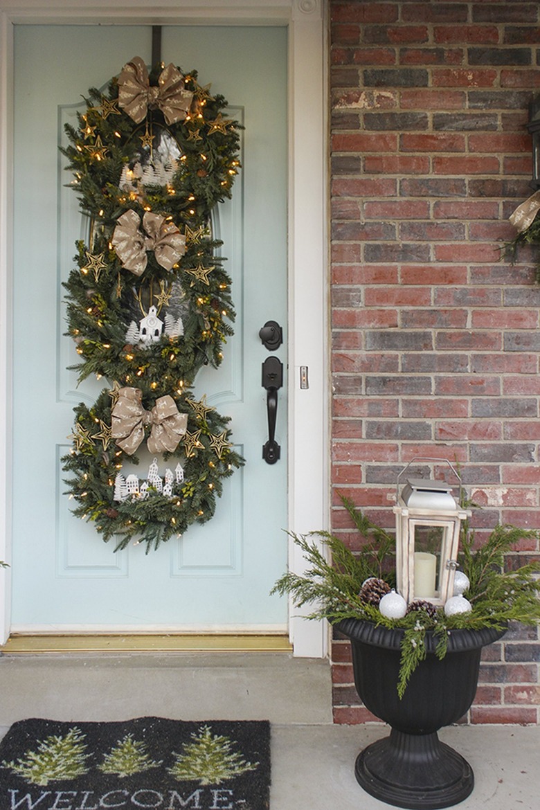 winter front porch with three wreaths