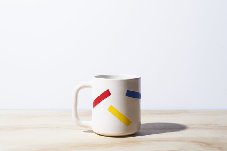 white mug with colorful pattern