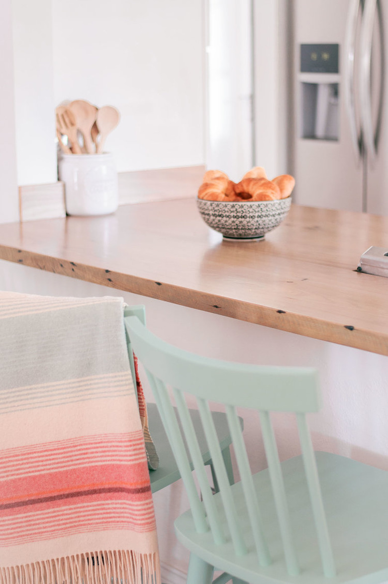 Reclaimed wood kitchen countertop with pastel accents