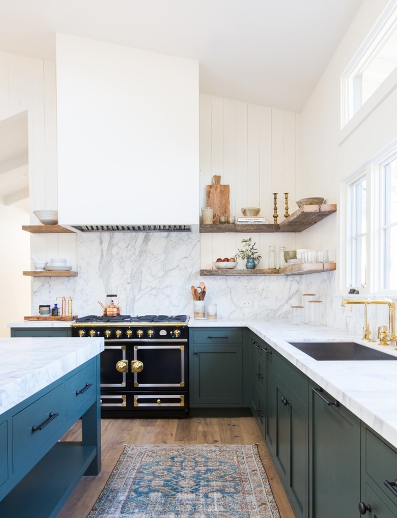 teal traditional kitchen cabinet doors in kitchen with vintage rug and floating shelves