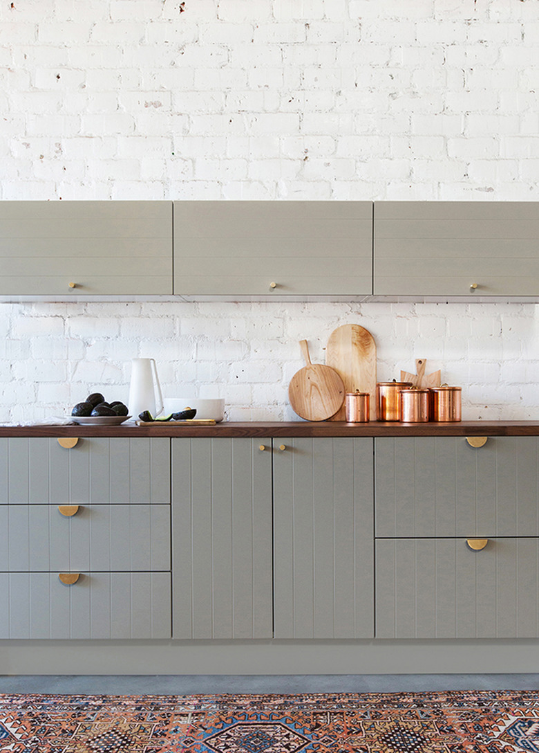 gray traditional kitchen cabinet doors with beadboard and brass handles