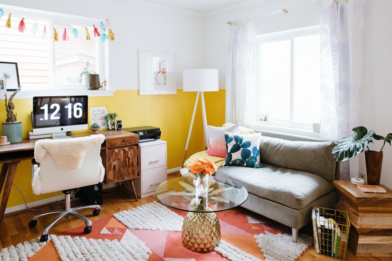 white home office with yellow colorblock, orange and pink rug