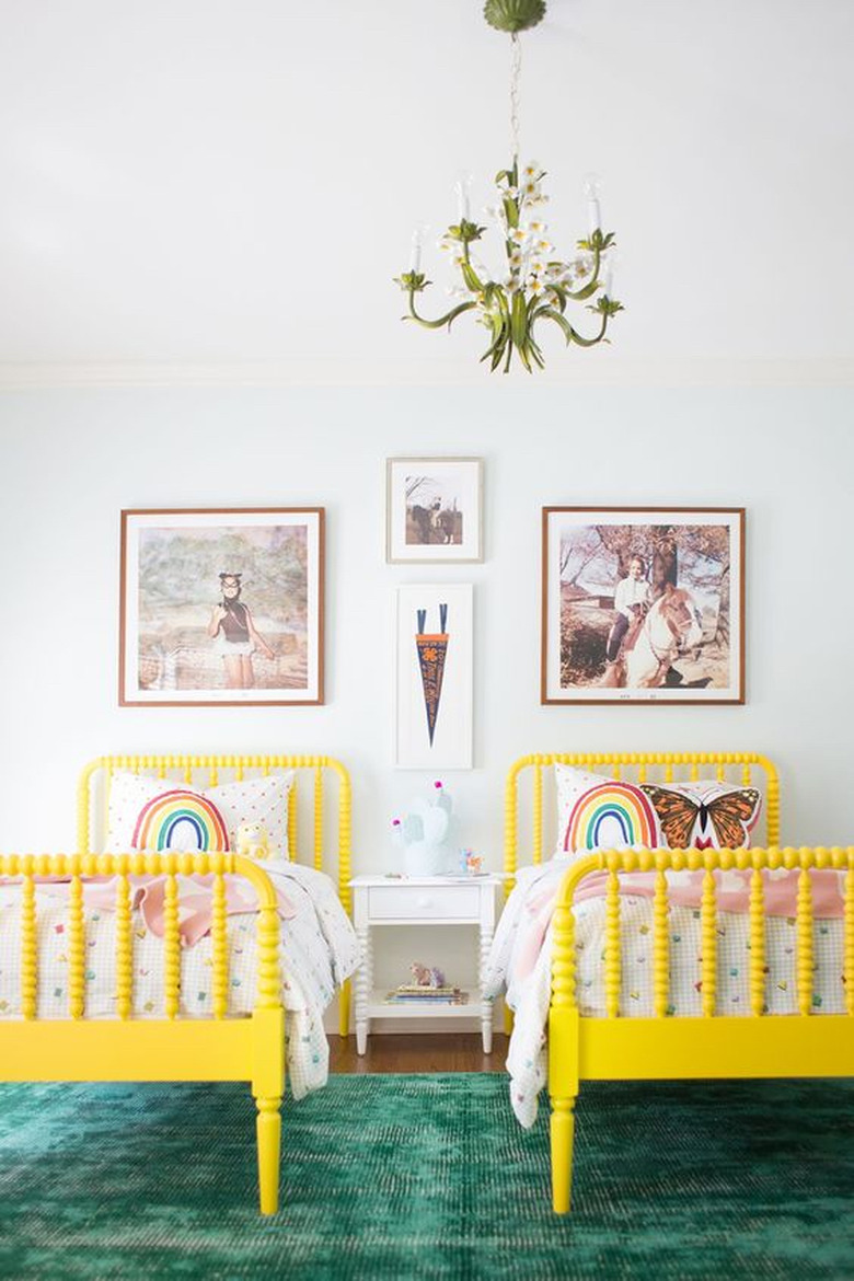 yellow kids bedroom idea with matching yellow beds and green area rug