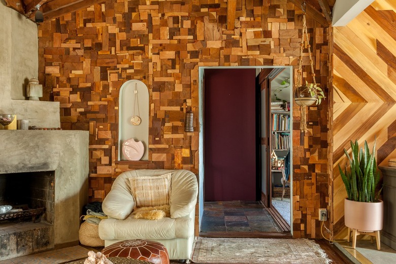 Yellow Room Ideas in Patterned wood panel wall, vintage leather lounge chair, concrete fireplace.