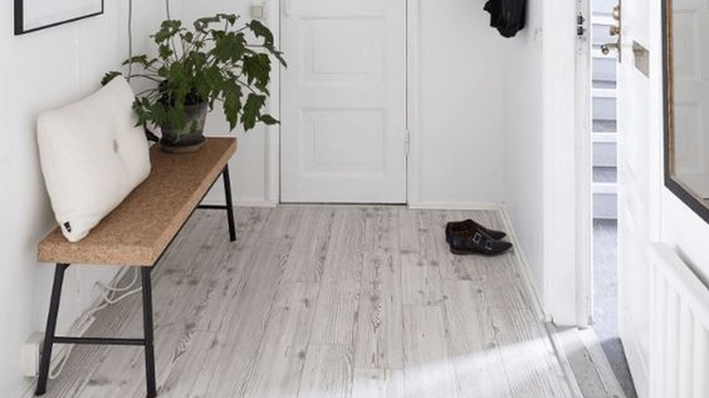 Hallway with white-washed floors