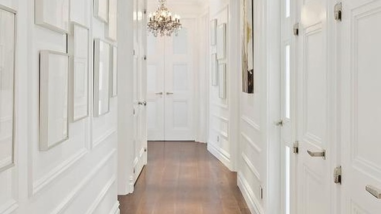 White hallway with molding