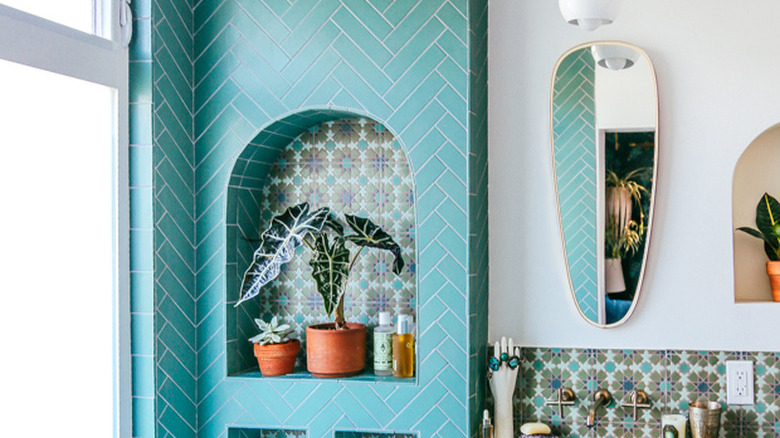 green bathroom idea with herringbone tile