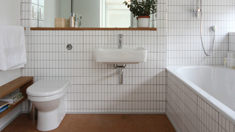 minimalist white bathroom with cork flooring