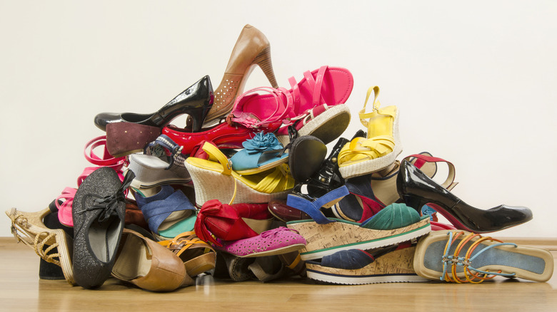 tall pile of an assortment of colorful shoes and high heels