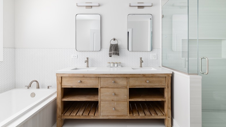 A bathroom with a bathtub and a walk-in shower