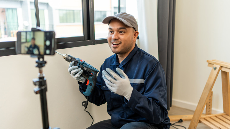 Technician recording video about an aspect of homebuilding