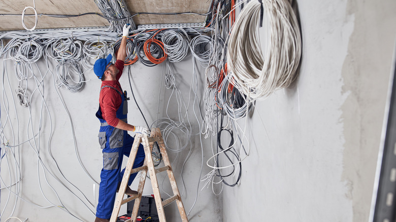 Worker managing extremely complicated wiring project