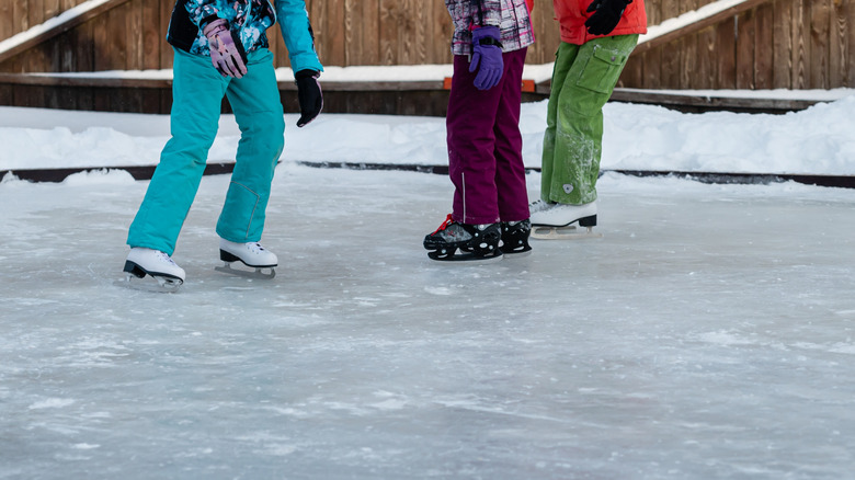 outdoor skating rink with a few children skating