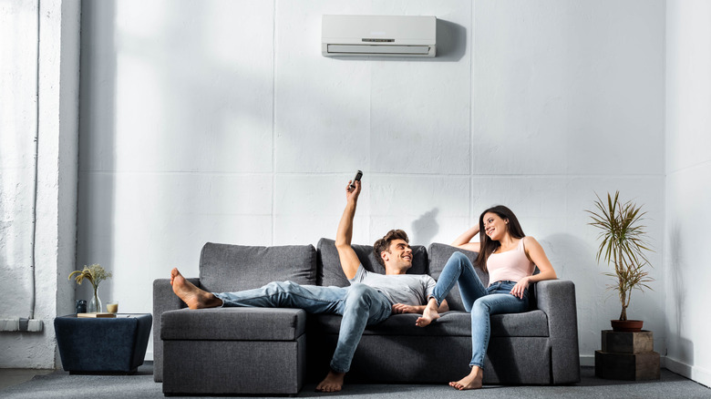 Couple on couch enjoying AC