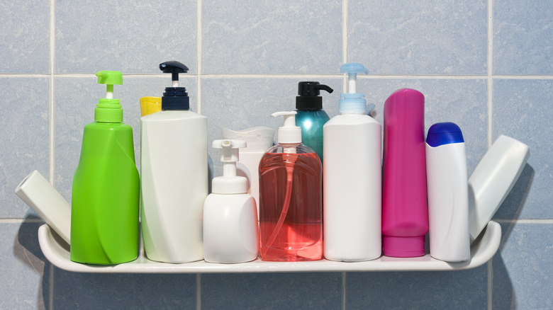 a shelf full of generic looking toiletries in plastic bottles